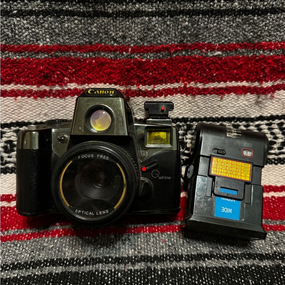 Canon Black and Silver Camera with Detachable Flash